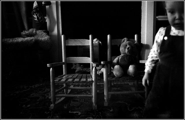 1 bear, 2 chairs, child and darkness